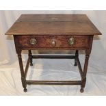 A George III oak rectangular side table with a single drawer in the frieze on turned legs,