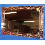 A 1950/60s rectangular wall mirror with rose tinted mirror edging,