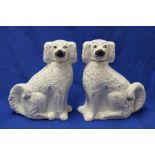 A pair of Victorian Staffordshire pottery seated spaniel figures with painted snouts,