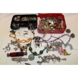 A large selection of various costume jewellery including necklaces, brooches, dress rings,