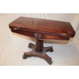 A 19th Century mahogany turn-over top card table on turned column with plateau base