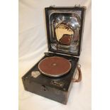 An old portable gramophone by Decca with chromium plated mounts in black fibre case