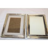 A George V silver mounted rectangular photo frame with raised decoration,