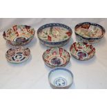 Seven various 19th century Imari pottery circular bowls with painted floral decoration,