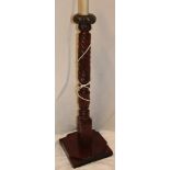 A good quality carved mahogany standard lamp with spiral twist stem and square shaped base