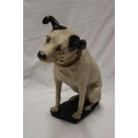 A composition figure of a HMV seated dog,
