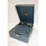 An old portable gramophone by His Master's Voice with chromium plated mounts in blue fibre case