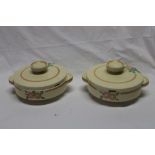 A pair of Clarice Cliff unmarked pottery circular Art Deco-style tureens and covers with painted