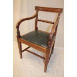 A 19th century mahogany carver arm chair with rope twist back and upholstered seat on square