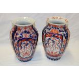 Two 19th century Japanese Imari pottery tapered vases with painted floral decoration,