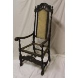 A 18th/19th century Continental carved open armchair with panelled back,