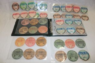 An album containing a collection of vehicle tax discs dating from 1956 onwards