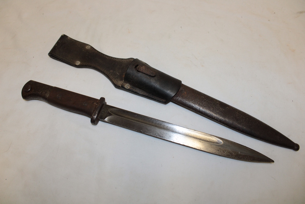 A Second War German Mauser bayonet with single edged blade marked "43ffc" in steel scabbard with