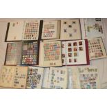 Fourteen albums/stock books containing a large selection of mixed World stamps