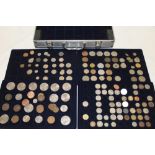 An aluminium collector's coin case containing a collection of various coins comprising various GB