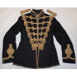 A blue cloth Officer's dress jacket of a Hussars Regiment circa 1910-15 with gilt braided front,