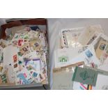 A large box of mixed World stamps on/off paper and a box of postal covers