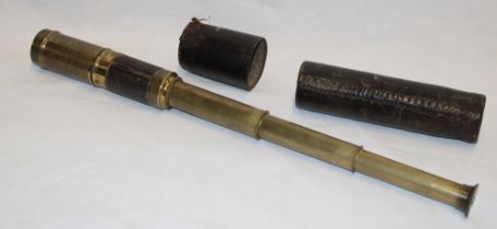 A 3-draw pocket telescope with part leather cover