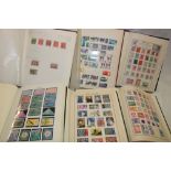 Six albums containing a selection of World stamps including a good selection of British