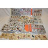 A large selection of various cigarette cards including numerous silk cigarette cards, Players Dogs,