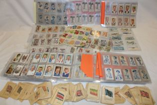 A large selection of various cigarette cards including numerous silk cigarette cards, Players Dogs,