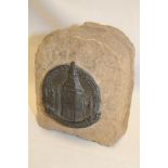 A fragment from the Houses of Parliament with raised plaque "Houses of Parliament London 1941"