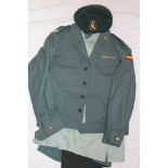 A Spanish Civil Guard uniform including beret, peaked cap, jacket,