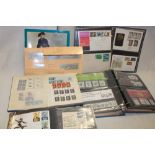 Two albums containing a selection of various first day covers and stamp presentation packs,