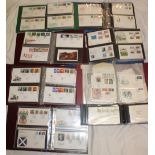 Eight folder albums containing a large selection of GB first day covers,