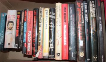 Various crime and murder related volumes including The Murderer's Who's Who, Criminal Minds,