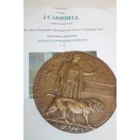 A First War bronze memorial plaque rewarded to James Cambelll