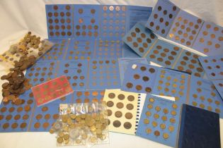 Various pre-decimal bronze coins in wallets including pennies and farthings and various others,