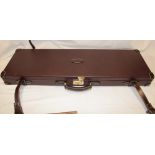 A virtually new Guardian baize lined gun case to fit 32"+ barrels complete with straps and key