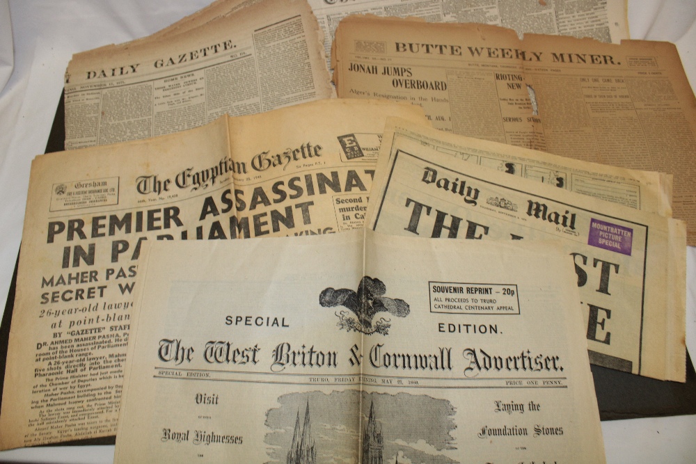 A small selection of collectable newspapers including The Butte Weekly Miner 1899, The Times 1969,