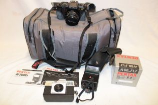 A Pentax P30 camera with accessories and case