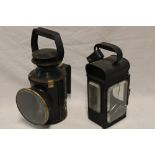 A British rail painted metal and brass mounted hand held railway lamp and one other painted metal