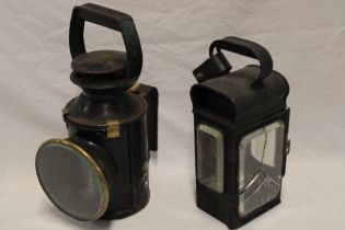 A British rail painted metal and brass mounted hand held railway lamp and one other painted metal