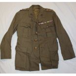 A Second War Officer's khaki four pocket tunic by Almond of Cambridge of the Bedford and Hertford