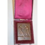 An unnamed rectangular bronze boxing medallion,