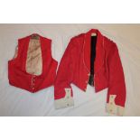 An Officer's scarlet mess dress jacket with matching waistcoat of the Bedford and Hertford Regiment