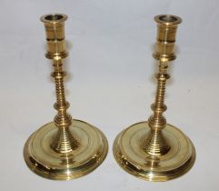 A pair of good quality brass beehive pattern candlesticks with circular bases marked with a