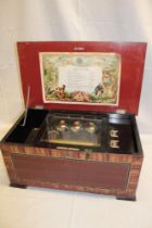 A 19th century music box with ten-tune card,