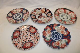 A 19th century Japanese Imari china circular plate with painted floral decoration and four various