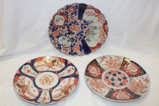 Three various 19th century and later Japanese Imari pottery circular chargers with painted floral