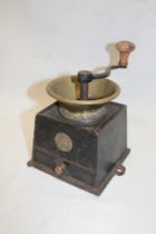 An old brass mounted iron coffee mill by Kenrick & Sons