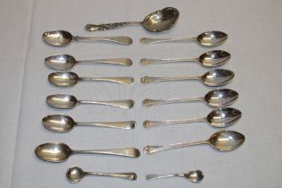 A set of six George V silver tea spoons with decorated handles, London marks 1927,