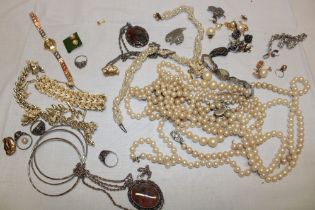 A selection of various costume jewellery including four various silver dress rings, bangles,