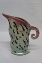 A studio pottery tapered jug of flattened form by Diane McCormick 12" high