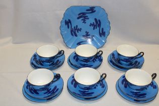 An unusual Shelley china tea set with dark and light blue decoration comprising six tea cups,