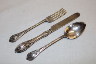 A Victorian ornamental silver bladed knife, fork and spoon with raised decoration,